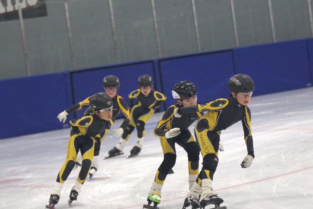 A skater in full kit at practice; the equipment in context.